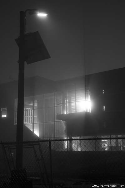 The partially-completed Rosenfield center by night