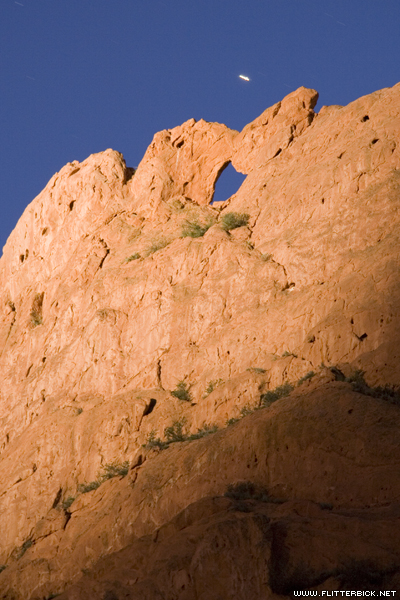 A star (or possibly Venus, I'm not sure) sets over the kissing camels. After dusk, the rocks are illuminated by a spotlight at the visitor's center