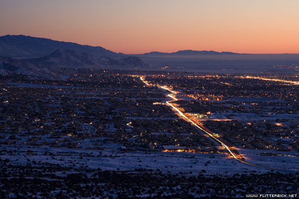 Headlights streak along Tramway boulevard