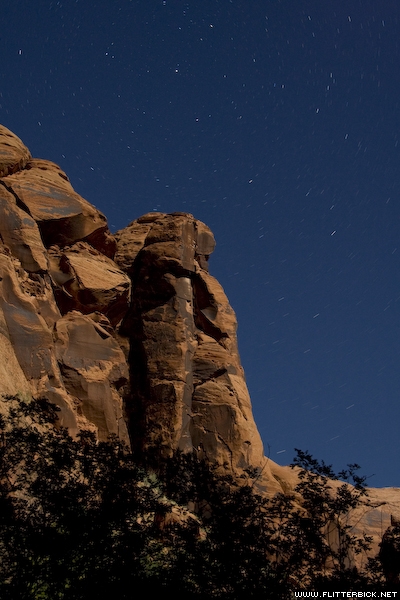 Stars spin above the rock walls of Coyote Gulch